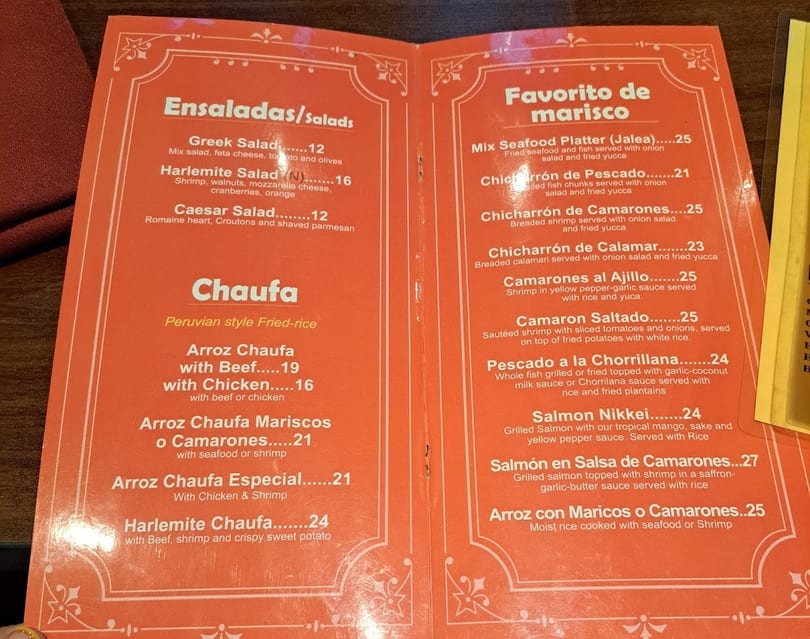An orange menu displays Peruvian Chaufa, salads, and seafood dishes with prices.